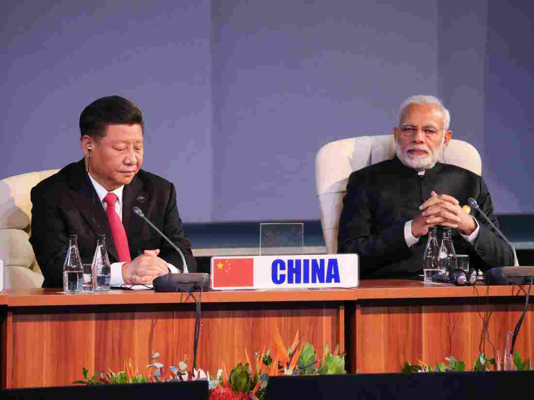 (LtoR) China's President Xi Jinping and India's Prime Minister Narendra Modi attend a session meeting during the 10th BRICS (acronym for the grouping of major emerging economies in the world namely Brazil, Russia, India, China and Africa) of the South) on July 27, 2018 in Johannesburg, South Africa.